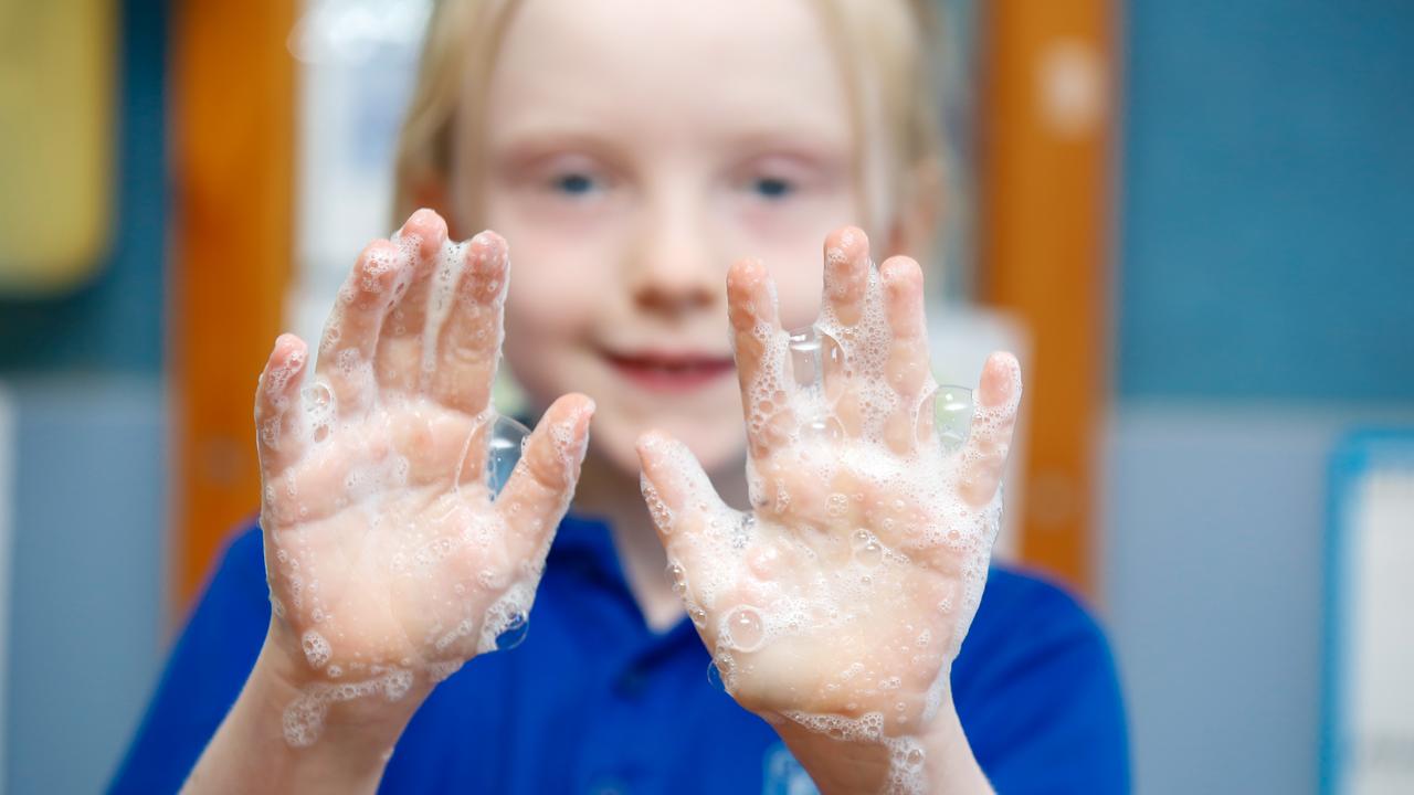 Abigail with soapy hands during a thorough hand washing session to clean her hands of dirt and germs. Picture: Glenn Campbell