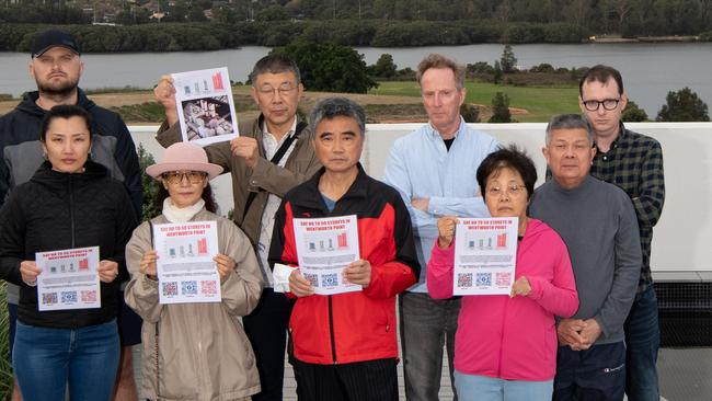 Wentworth Point residents including Anna Han (from row, far left) have long lobbied for infrastructure in their suburb. Picture: Monique Harmer