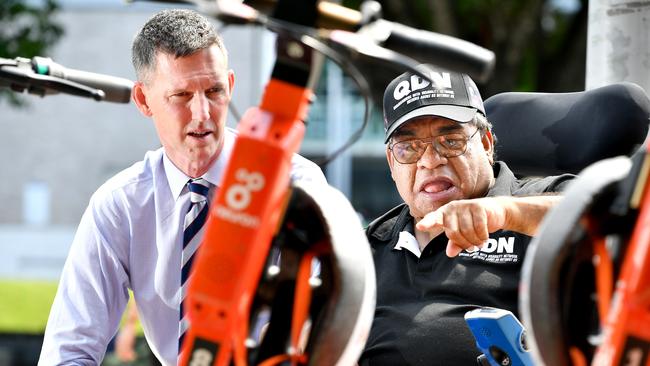 Transport and Main Roads Minister Mark Bailey and Wilfred (Uncle Wille) Prince with some e-scooters. Picture: NCA NewsWire / John Gass