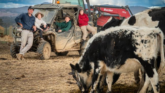 Whorouly dairy farmer Jon Pethybridge and his children Owen 12, Molly 10, and Nora 6, haven’t seen any rain in about 50 days, and are in desperate need. Photo Simon Dallinger