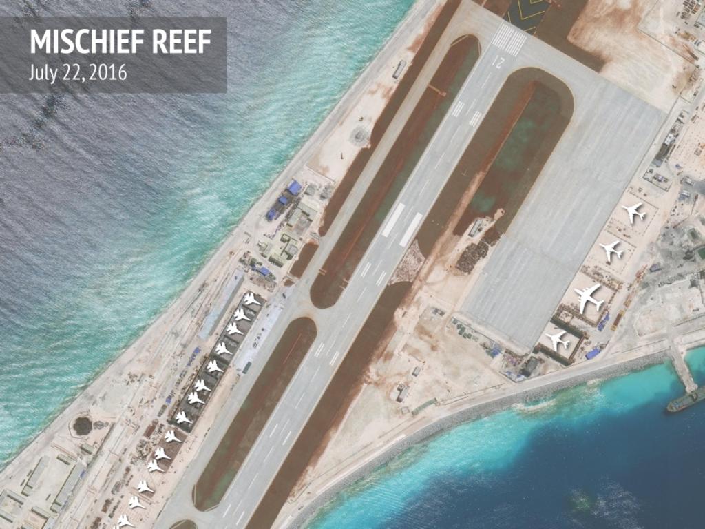 A satellite photograph provided by the Asia Maritime Transparency Initiative (AMTI) showing the airfield at Mischief Reef, with superimposed outlines of the types of Chinese combat aircraft the facilities could support. Picture: AMTI/CSIS