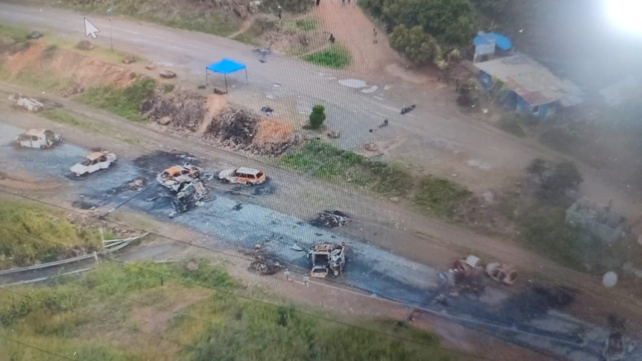 This aerial view shows burnt out vehicles scattered along a highway on the outskirts of Noumea. Picture: AFP