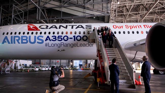 An Airbus A350-1000 aircraft is seen inside a hangar at Sydney international airport on May 2, 2022, to mark a major fleet announcement by Australian airline Qantas. - Qantas announced on May 2 it will launch the world's first non-stop commercial flights from Sydney to London and New York by the end of 2025, finally conquering the "tyranny of distance". (Photo by Wendell TEODORO / AFP)