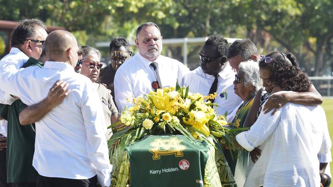 The service for John {Jack } Long {1937-2019 } was held at Gardens Oval as family and friends say farewell to football royalty  Michael Long {centre} at his fathers coffin  Picture Katrina Bridgeford