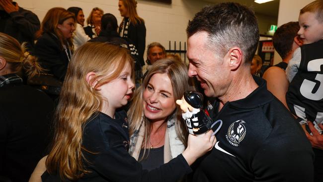 The Pies coach in the rooms with daughter Charlie. (Photo by Michael Willson/AFL Photos via Getty Images)