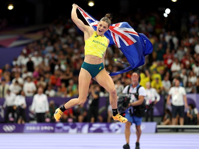 Nina Kennedy leaps into the air after winning gold. Picture: Cameron Spencer/Getty Images