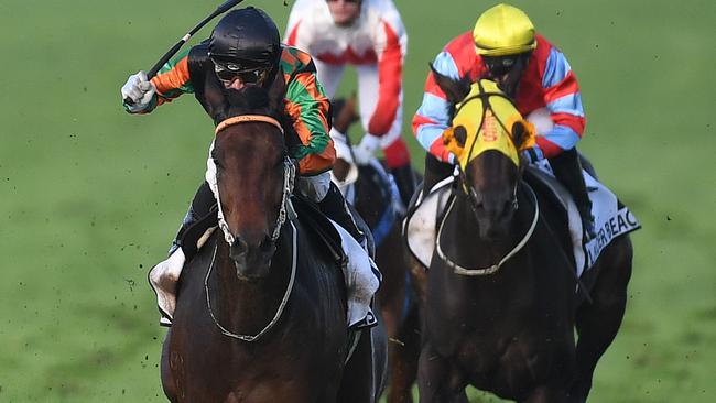 Jockey Corey Brown (centre) rides Sense of Occasion to win race seven, the Doomben Cup, at Doomben Racecourse in Brisbane, Saturday, May 20, 2017. (AAP Image/Dan Peled) NO ARCHIVING, EDITORIAL USE ONLY