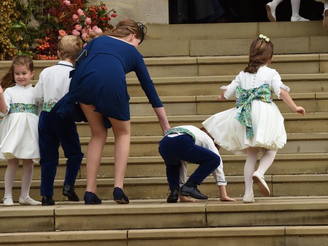 Pageboy Louis De Givenchy also tripped and fell on his way into the church, while special attendant Lady Louise Windsor, 14, accidentally flashed her knickers when a rogue gust of wind struck. Picture: Getty