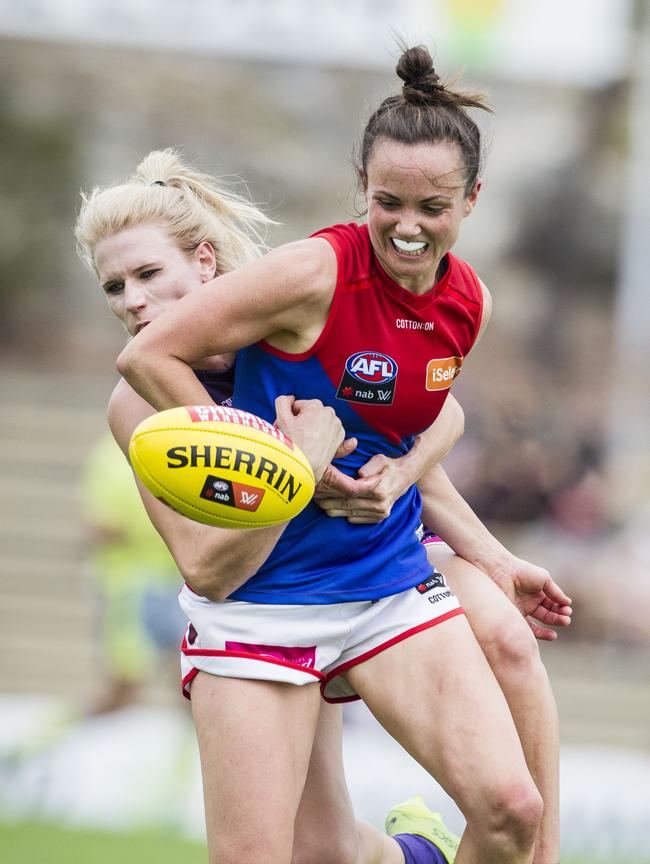 Daisy Pearce and Dana Hooker battle for the ball. Picture: AAP