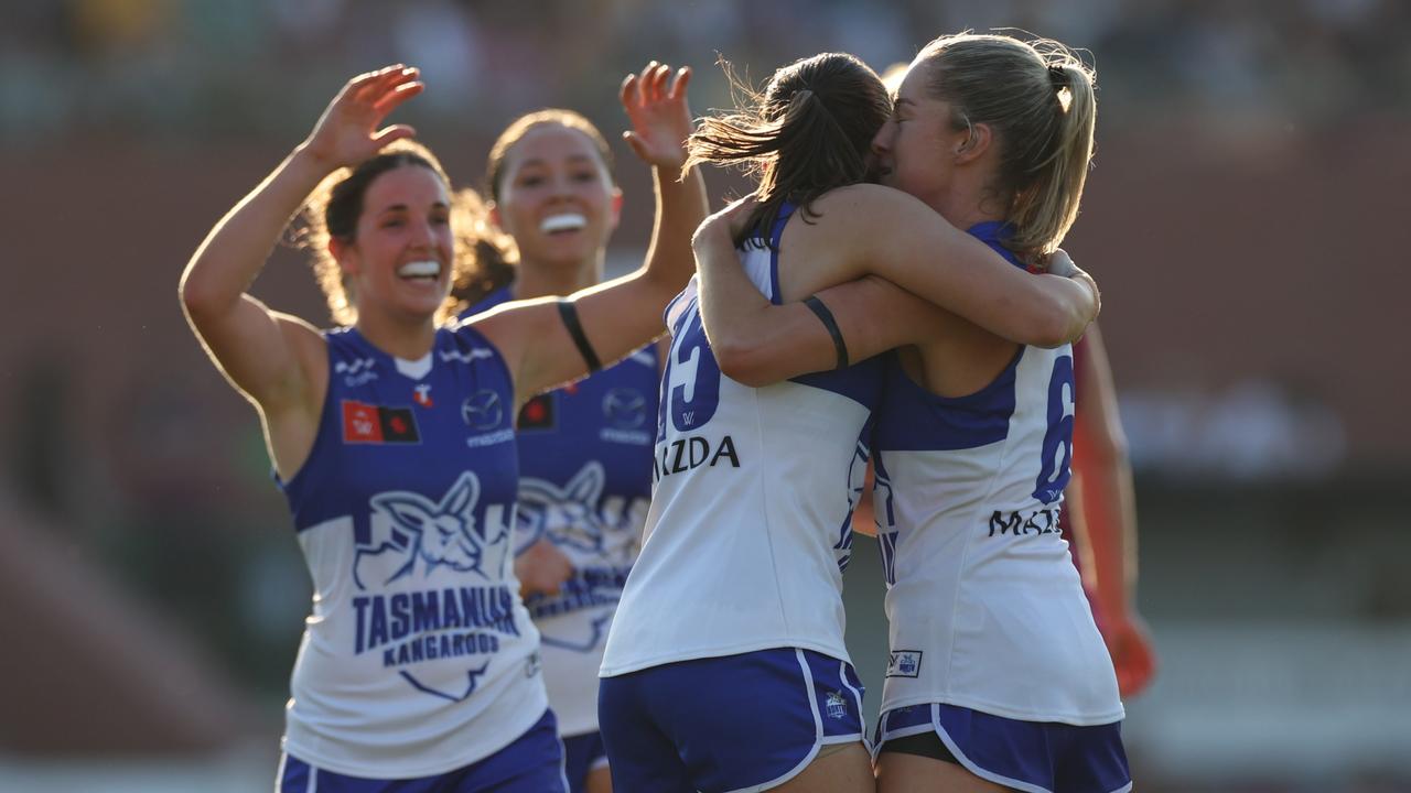 BRISBANE, AUSTRALIA - SEPTEMBER 01: Alice O'Loughlin and Amy Smith of the Kangaroos celebrate a goal during the round one AFLW match between Brisbane Lions and North Melbourne Kangaroos at Brighton Homes Arena, on September 01, 2024, in Brisbane, Australia. (Photo by Mackenzie Sweetnam/Getty Images)