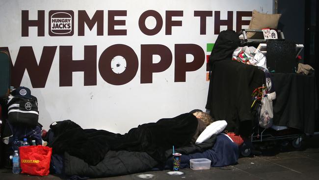 Homeless people on Swanston Street, Melbourne. Picture Yuri Kouzmin