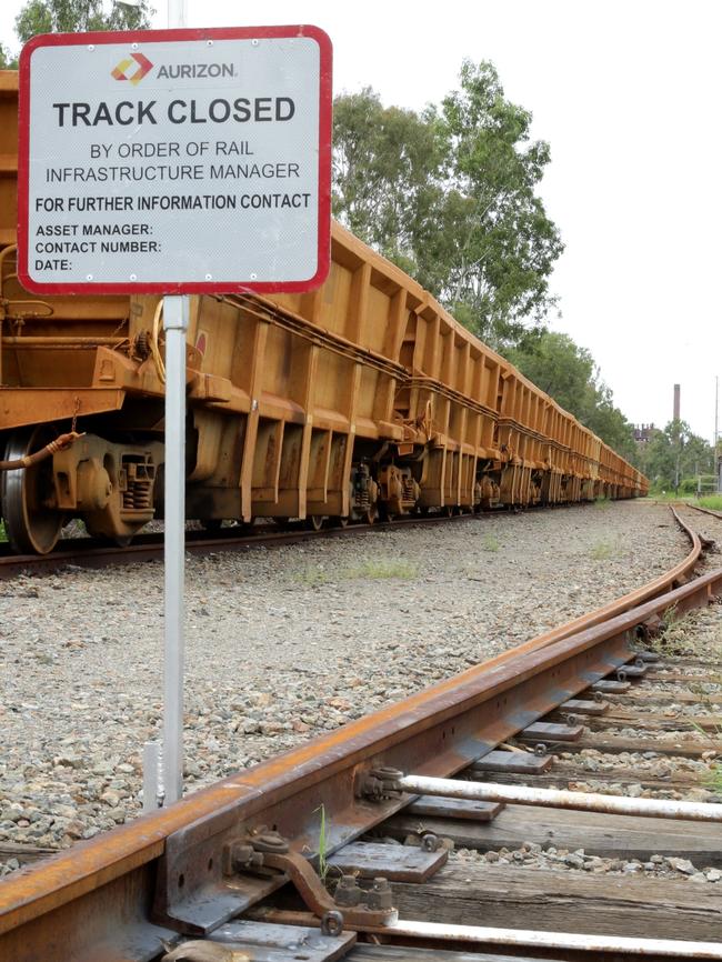 An empty train sits idle on tracks leading to Clive Palmer's Queensland Nickel refinery, Townsville. Picture: Liam Kidston