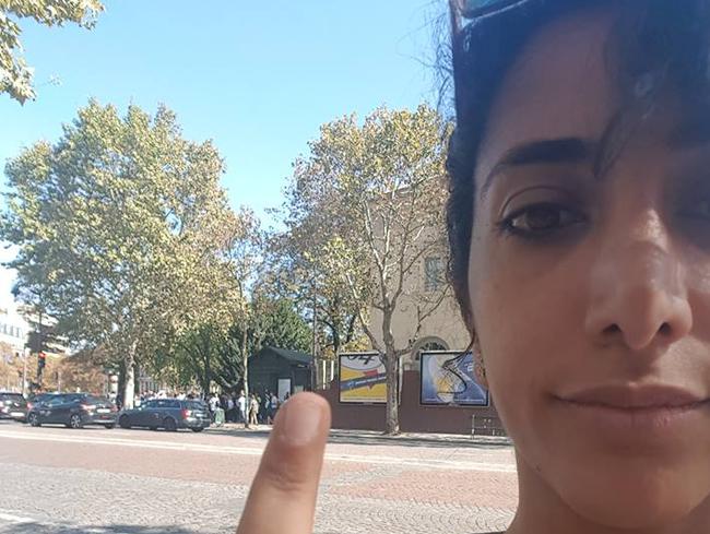 Roya Abdolhosini flips the bird outside the Paris catacombs entrance after being denied entry.