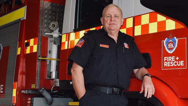 Brad Harrison hangs his gear up for the last time at Ballina Fire Station after 43 years as a firefighter. Picture: Tessa Flemming