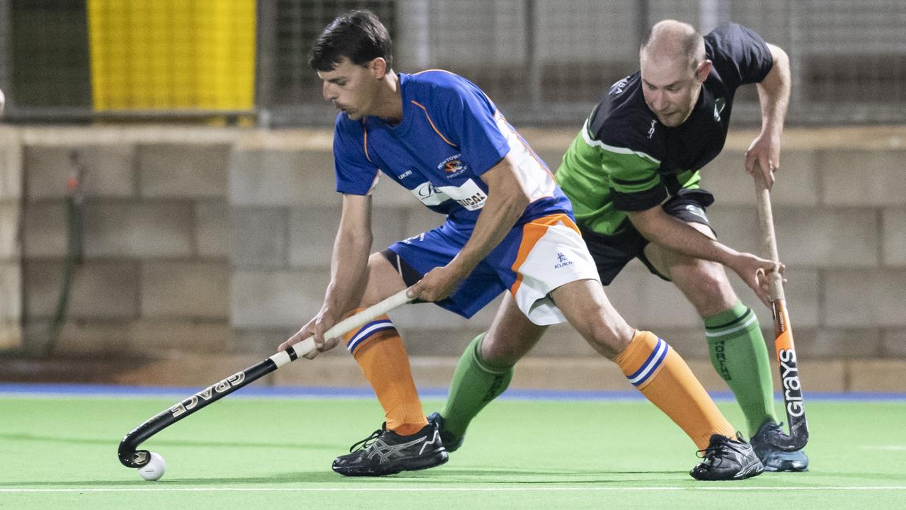 Josh McPaul for Newtown and Micah Mathewson for Norths. A1 mens hockey, Newtown vs Norths. Picture: Nev Madsen.