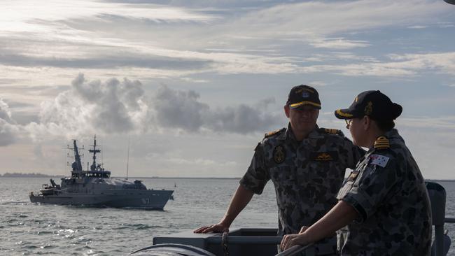 HMA Ships Maryborough and Pirie (background) conduct manoeuvring exercises.