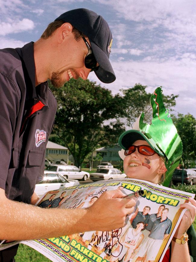 NBL - Avid supporter SKYE MILLARD, 11 gets an autograph from Townsville Crocodiles player ANDREW GOODWIN during parade - sport basketball profile fans parades May 05 2001 NQ