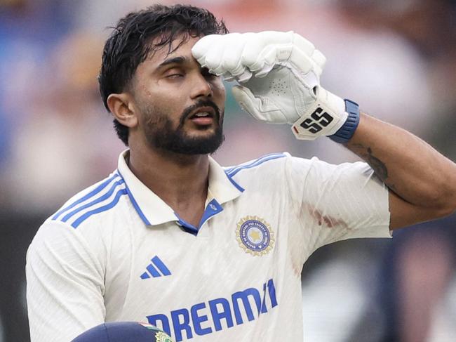 India's Nitish Kumar Reddy celebrates after passing 100 on day three of the fourth cricket Test match between Australia and India at the Melbourne Cricket Ground (MCG) in Melbourne on December 28, 2024. (Photo by Martin KEEP / AFP) / -- IMAGE RESTRICTED TO EDITORIAL USE - STRICTLY NO COMMERCIAL USE --