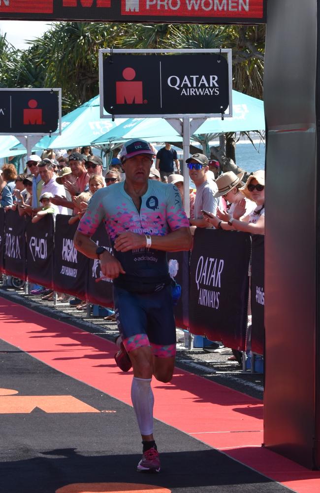 Athletes crossing the finish line at the Sunshine Coast Ironman 70.3 2023.