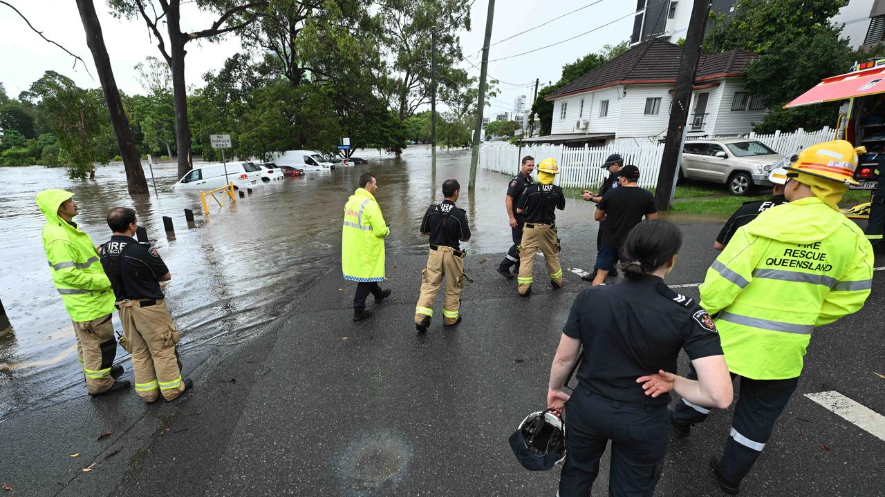 1/122024: Flash flooding in Hanlon Park, rapidly flooded around 10 cars, as police and fire and rescue check the cars are empty, Stones Corner, Brisbane. pic: Lyndon Mechielsen/Courier Mail