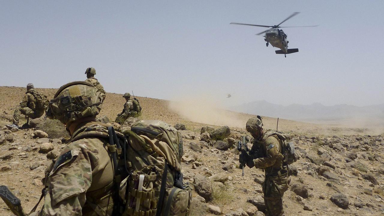 Australian Army soldiers from Special Operations Task Group prepare to be extracted by a US Army Black Hawk helicopter after completing the clearance of a cave system in Uruzgan province, southern Afghanistan, in 2012. Picture: Department of Defence