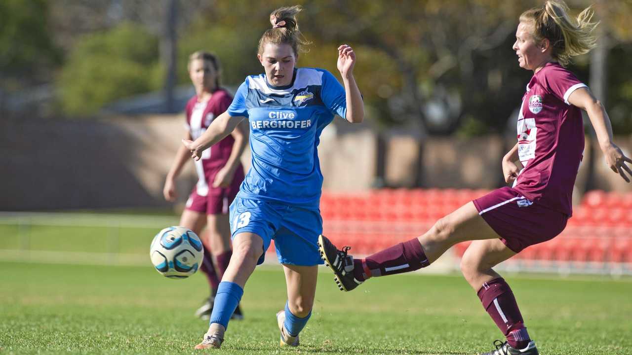 CLOSE QUARTERS: South West Queensland Thunder player Caitlyn Stocker (left) puts pressure on her Logan Lightning opponent. Picture: Kevin Farmer