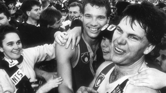 Danny Frawley celebrates a win with his St Kilda teammates.