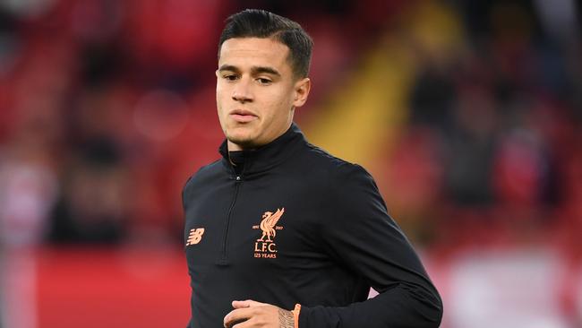 Liverpool's Brazilian midfielder Philippe Coutinho warms up before the UEFA Champions League Group E football match between Liverpool and Sevilla at Anfield in Liverpool, north-west England on September 13, 2017. / AFP PHOTO / Paul ELLIS