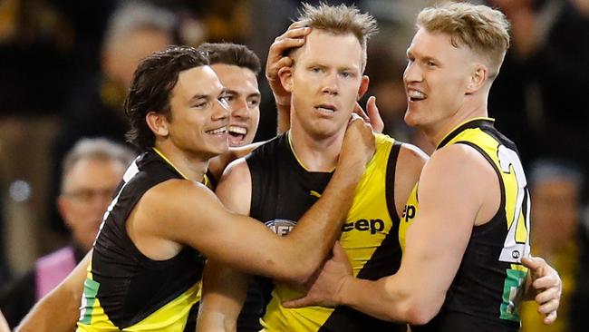 Daniel Rioli, Jack Riewoldt and Josh Caddy celebrate Richmond’s win against the Crows. Picture: Michael Willson/AFL Media/Getty Images