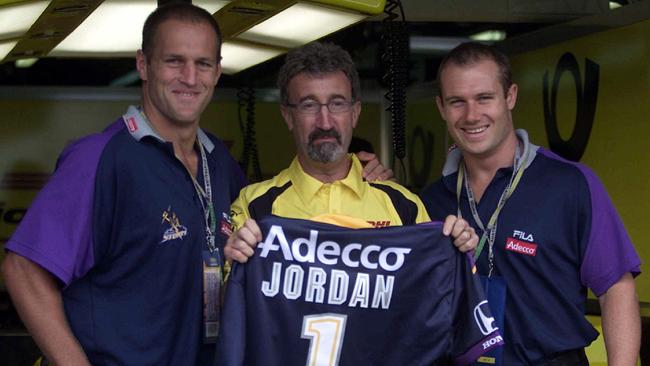 Melbourne Storm players (left) Rodney Howe and Robbie Ross present Jordan with a Storm back in 2002.