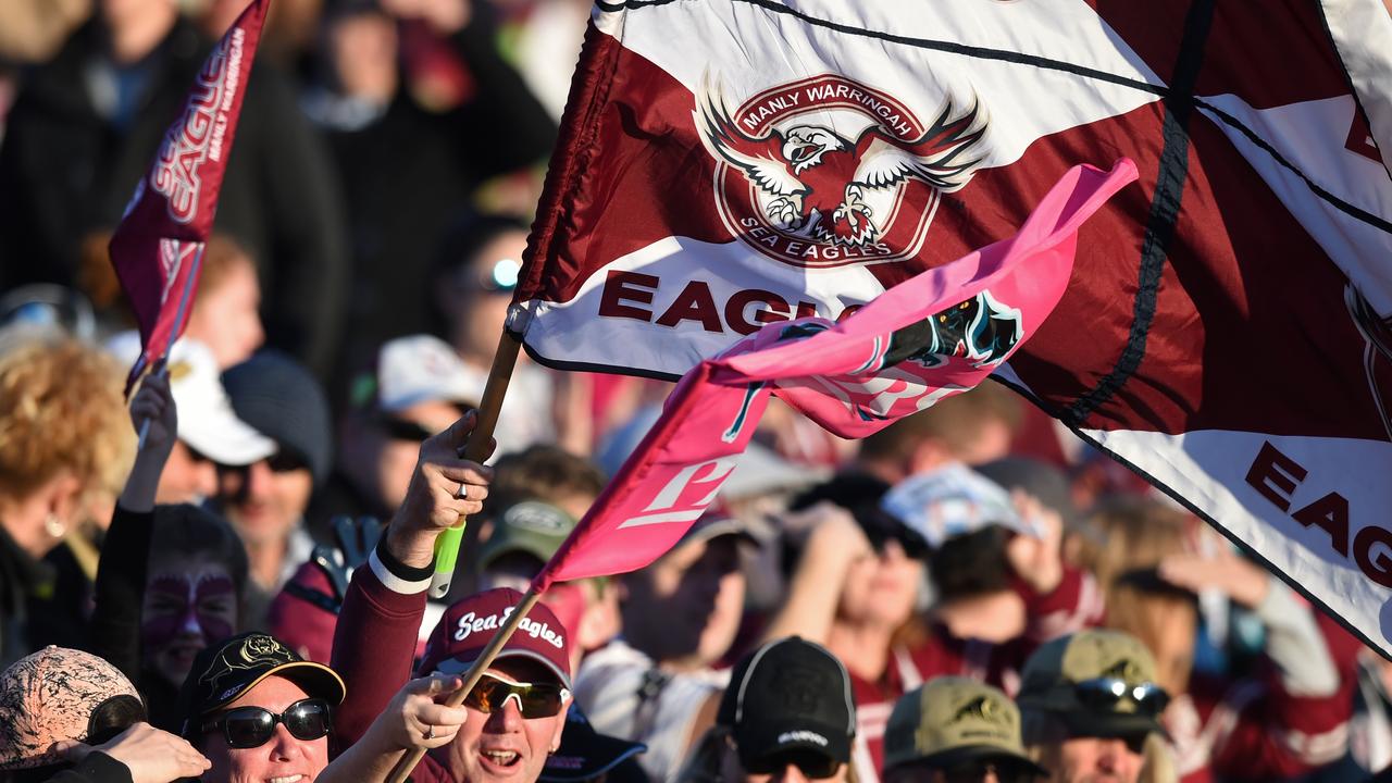 Sea Eagles and Panthers fans wave a flag during the Round 14 NRL match between the Manly-Warringah Sea Eagles and the Penrith Panthers at Brookvale Oval in Sydney, Sunday, June 12, 2016. (AAP Image/Paul Miller) NO ARCHIVING, EDITORIAL USE ONLY