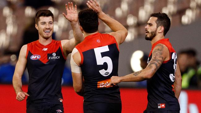 Alex Neal-Bullen, left, Christian Petracca and Jeff Garlett of the Demon. Picture: AAP Image/Daniel Pockett