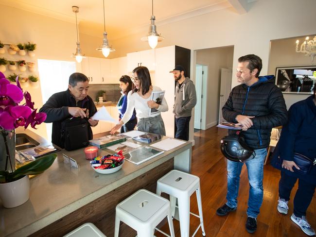 Pictures of perspective buyers making use of the 'Open House' to inspect 52A Rofe Street, Leichhardt on 30th June 2018. The lady with white jumper and glasses is agent Simone Azzi from Belle Property.  (Pictures by Julian Andrews).