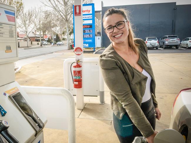 SAVINGS: Bridie Stouppos takes advantage of cheap fuel in Mile End. <b>Picture: AAP/ROY VANDERVEGT</b>