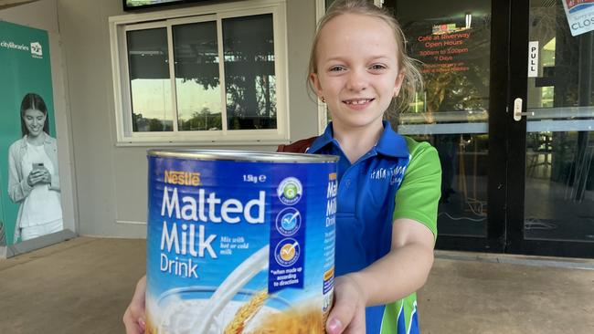 Cafe at Riverway helper Brienna Steele, 11, with the malted barley her parents use to make the cafe's 'old school' vanilla malt milkshakes.