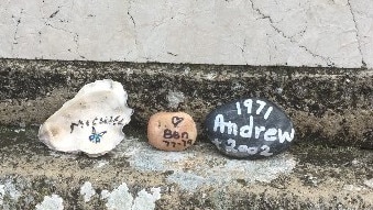 Stones the mothers left in remembrance of their three sons, Michael, Ben and Andrew. Picture: Contributed