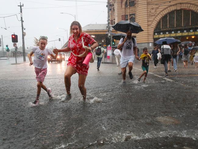 The storm caused flash flooding on Flinders St. Picture: David Crosling