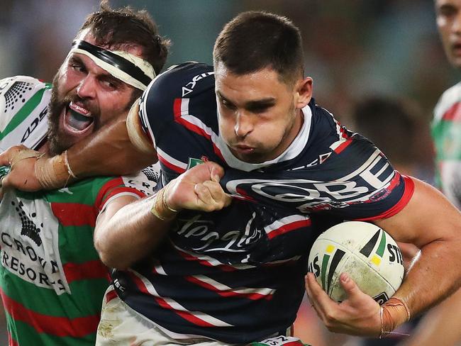 Roosters' Ryan Matterson tackled by Rabbitoh's Mark Nicholls during NRL match Sydney Roosters v South Sydney Rabbitohs at Allianz Stadium. Picture. Phil Hillyard