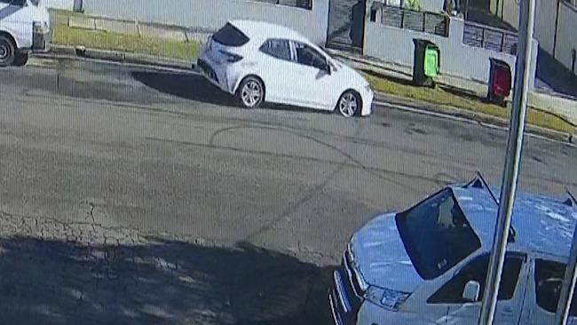 CCTV from neighbours also shows the white vehicle involved in the pursuit pulling up in front of houses, before the driver quickly jumps out and runs. Pic Supplied.