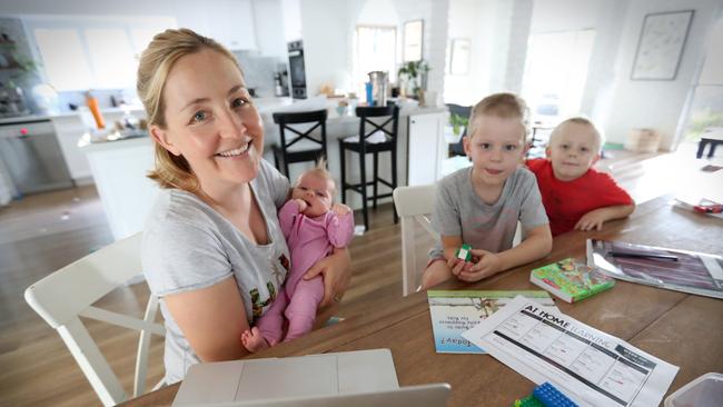 Claire Cameron said a live teacher on Zoom would really help when trying to school her six year old, Ollie 6, while parent Cooper, 4.5 and Matilda who is seven weeks old. Picture: Jamie Hanson