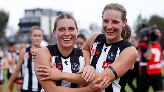 Abbi Moloney and Imogen Barnett celebrate their win over the Western Bulldogs in front of a full house at Victoria Park.