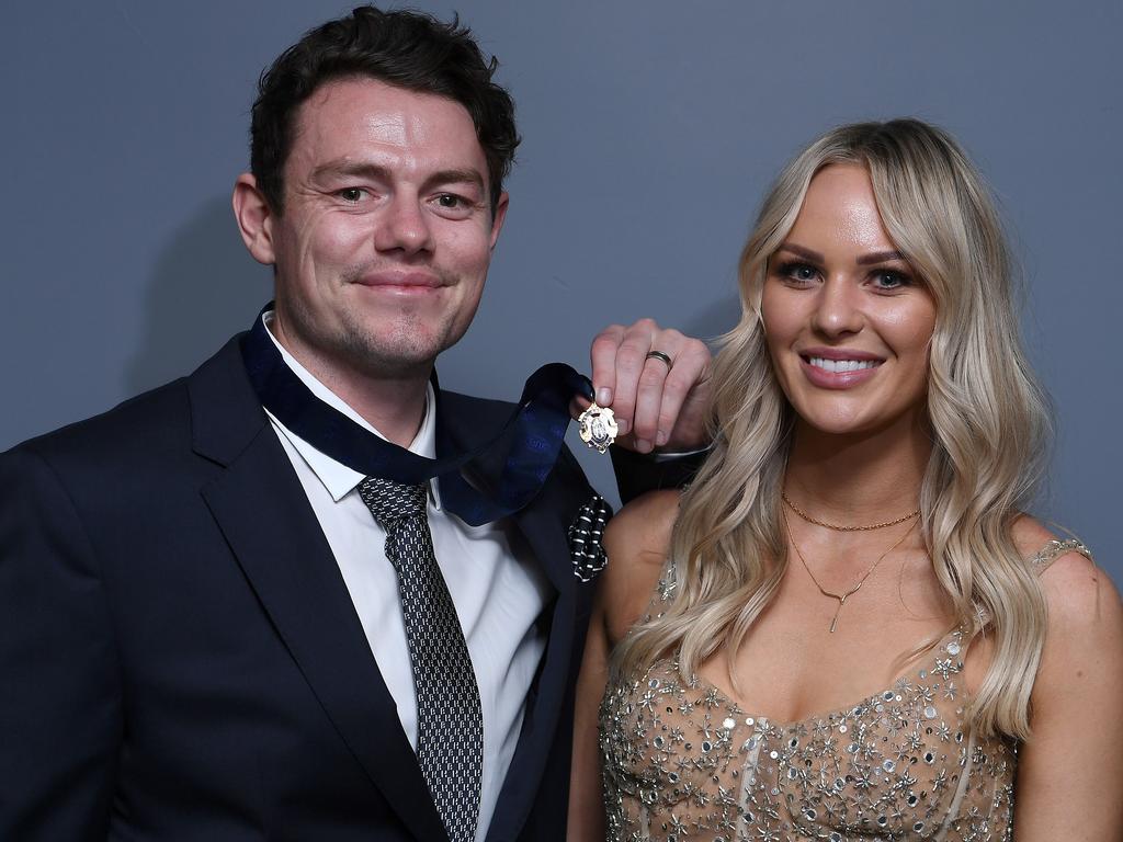 Lachie Neale of the Lions poses with his wife Julie Neale after winning the Brownlow Medal. Photo by Quinn Rooney/Getty Images.