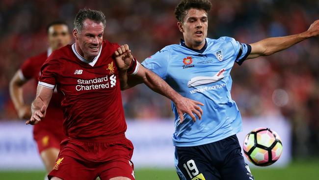 George Blackwood of Sydney FC is challenged by Jamie Carragher