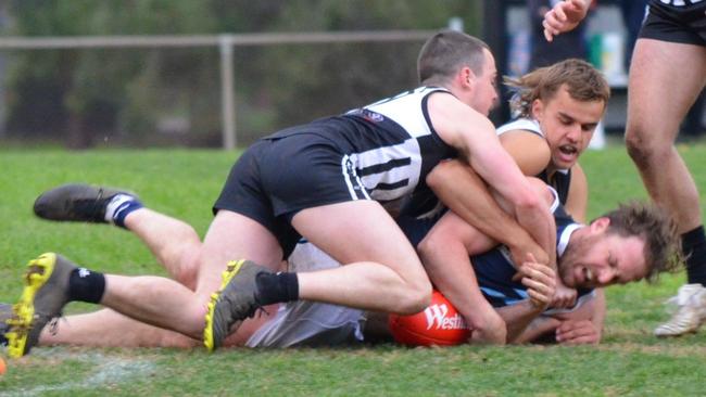 Surrey Park’s Oliver Anderson lays a strong tackle on Saturday. Picture: Surrey Park FC