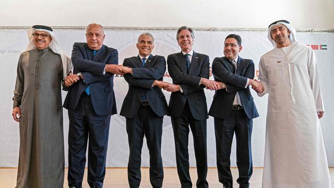 From left, Bahrain Foreign Minister Abdullatif bin Rashid al-Zayani, Egypt’s Sameh Shoukry, Israel’s Yair Lapid, US Secretary of State Antony Blinken, Morocco’s Nasser Bourita and the UAE’s Abdullah bin Zayed al-Nahyan at the Sde Boker kibbutz in the Negev desert on Monday. Picture: AFP