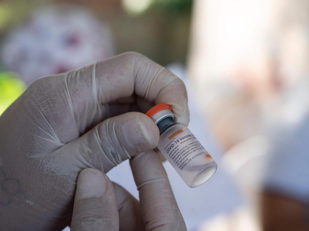 A health worker prepares a dose of the CoronaVac vaccine against Covid-19 to inoculate a Venezuelan child. Picture: Yuri Cortez / AFP