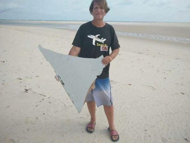 Blaine Gibson with his “No Step” piece — a fragment of horizontal stabiliser from the tail of MH370 — picture in Mozambique in March.