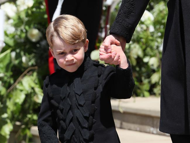 Prince George in a mini version of Prince Harry’s outfit. Picture: Brian Lawless — WPA Pool/Getty Images.