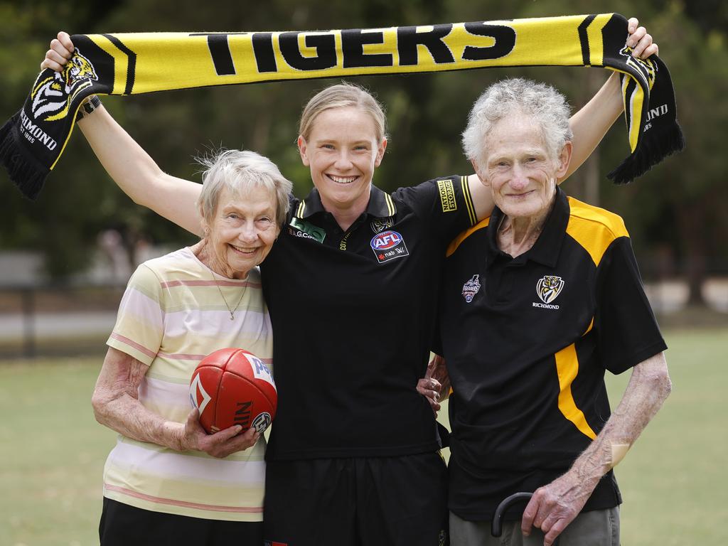 Sarah D'Arcy (Richmond AFLW player) and her grandparents Margaret and Brian Walker, for a feature story for Friday paper. Sarah's grandparents barely miss a game - a photo of them all went viral last year on twitter. Picture: Alex Coppel.