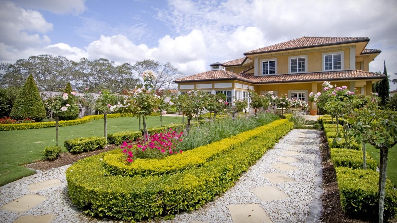 The driveway of this French provincial-inspired home leads to a full turning circle around a feature water fountain surrounded by manicured gardens conceived by landscape designer Wayne Moffatt, of Image IDG. Moffat’s handiwork is also visible at the beautiful Hunter Valley Gardens, however, it is this home’s location by the exclusive Links Golf Course that seals its position as one of the Gold Coast’s best backyards. Picture Mike Batterham